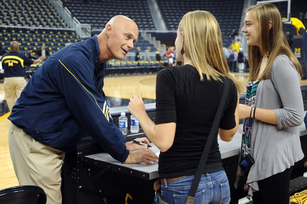 Michigan women's basketball coach Kevin Borseth chats with fans as he signs autographs during an open house at Crisler Arena on Friday evening. Melanie Maxwell I AnnArbor.com
